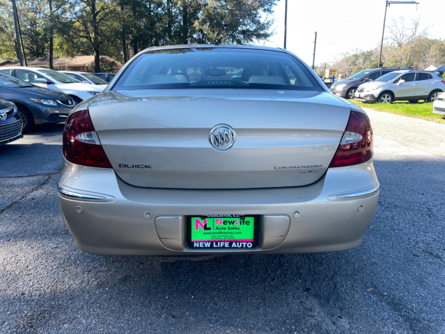 2005 GOLD BUICK LACROSSE CXL (2G4WD562351) with an 3.8L engine, Automatic transmission, located at 5103 Dorchester Rd., Charleston, SC, 29418-5607, (843) 767-1122, 36.245171, -115.228050 - Local Trade-in with Leather, CD/AM/FM, OnStar, Dual Climate Control, Power Everything (windows, locks, seats, mirrors), Keyless Entry, Chrome Wheels. Clean CarFax (no accidents reported!) Only 119k miles! Located at New Life Auto Sales! 2023 WINNER for Post & Courier's Charleston's Choice Pre-owned - Photo#5